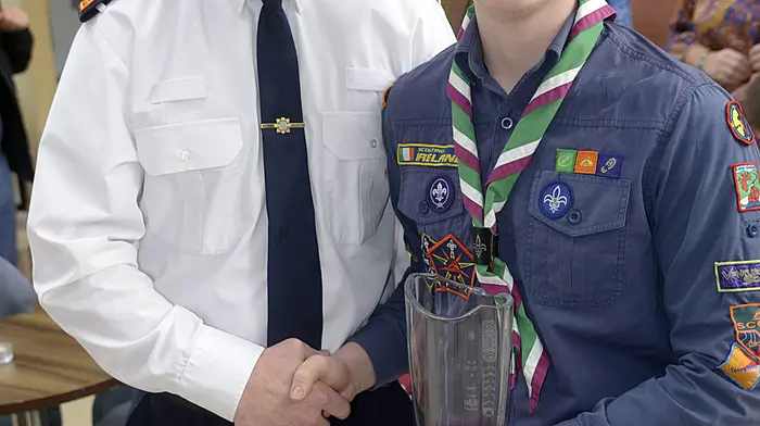 Macroom scouts member Gavin Browne accepting his award from Supt Niall O'Connell at the West Cork Garda Youth Awards.  (Photo: Denis Boyle)
