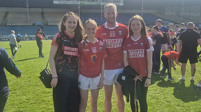 Emma Downey, Castletownbere was selected to play for Cork Primary Games which took place during the half-time of the Cork versus Tipperary match at Semple Stadium, Thurles last weekend. The player in the photo is Ruairi Deane who is also a teacher at Scoil Phobail Bhearra where Emma attends. Included in the photo Emma's sisters Amy and Katie Downey.
