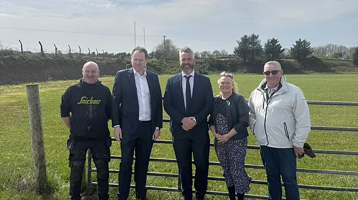 Minister Charlie McConalogue with Minister Christopher O’Sullivan and the Ballinadee Community Association visiting the Ballinadee community pitch last week.