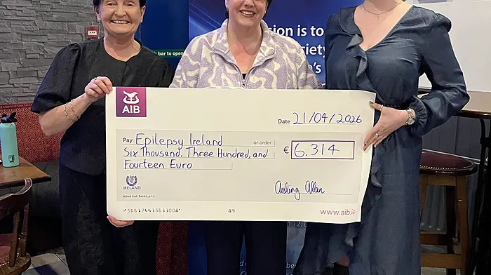 Niamh Jones (Epilepsy Ireland Cork) with Aisling Allan presenting a cheque for €6,314, the proceeds of the recent cake sale at the Carrigaline Soccer Club, in aid of Epilepsy Ireland to Niamh Lonergan (Dublin headquarters, Epilepsy Ireland)