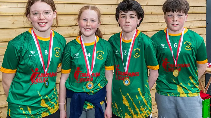 The Ardfield NS 1 crew celebrate with their medals. (Photo: Andy Gibson)