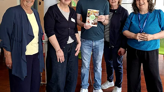 Denis O’Donovan of Clonakilty Library recently visited The Friendly Fuchsia Café in Clonakilty where he presented a set of Come Sit Awhile books and bookmarks to visitors of the café.  From left: Vanessa Bradbury (Alzheimer’s Society of Ireland), Kerrin Relja (community dementia support worker), Denis O’Donovan (librarian), Josephine Kelly (volunteer), and Bernadette Horgan Edmead (dementia care coordinator).