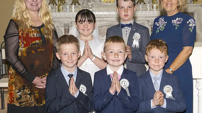 Carrigboy National School pupils celebrated their First Holy Communion on Saturday in the Sacred Heart Church, Durrus. Back: Ms Mee, Hannah Louise Deasy, Tom Ward and Ms Hurley. Front: Calum Casey, Aidan Daly and Ciarán O'Sullivan.