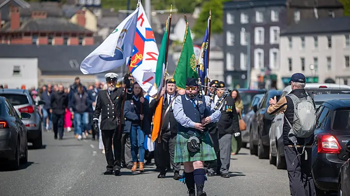A piper leads a parade from St Multose Church to the wreath laying ceremony as part of the Annual Ecumenical Sea Sunday service in Kinsale to commemorate those lost at sea.  (Photo: John Allen)