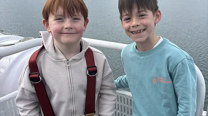 Enda Flannery and Finn Browne setting off on the Cape Clear Ferry around Baltimore harbour with Rath National School.