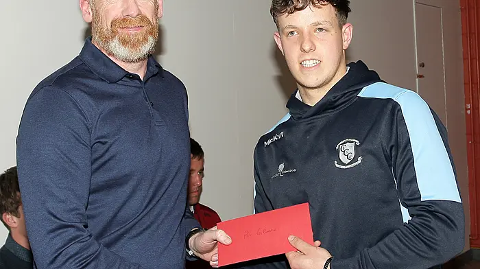 Clonakilty Community College's Dylan Harrington made a presentation to coach Pat Gilmore. (Photo: Paddy Feen)