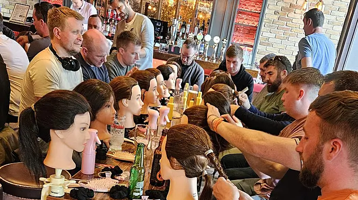 Barber gives dads crash course in hairstyling Image