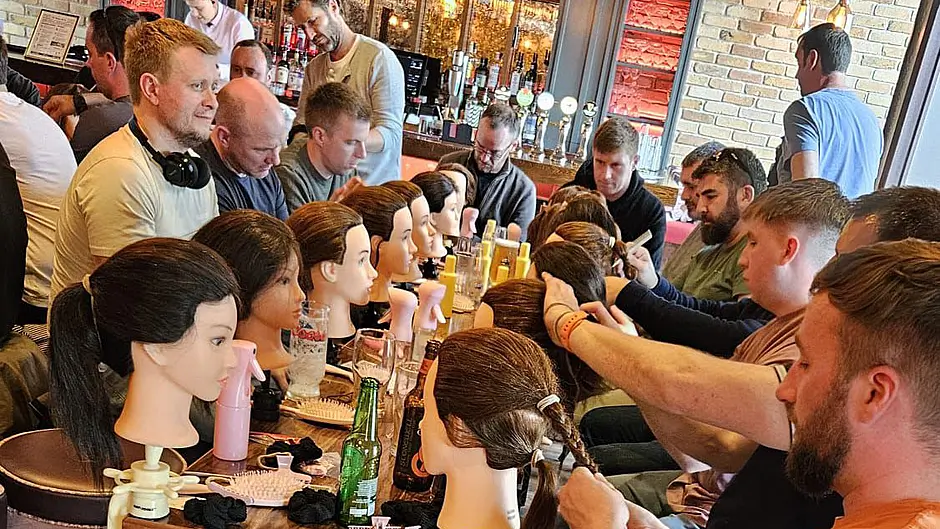 Barber gives dads crash course in hairstyling Image