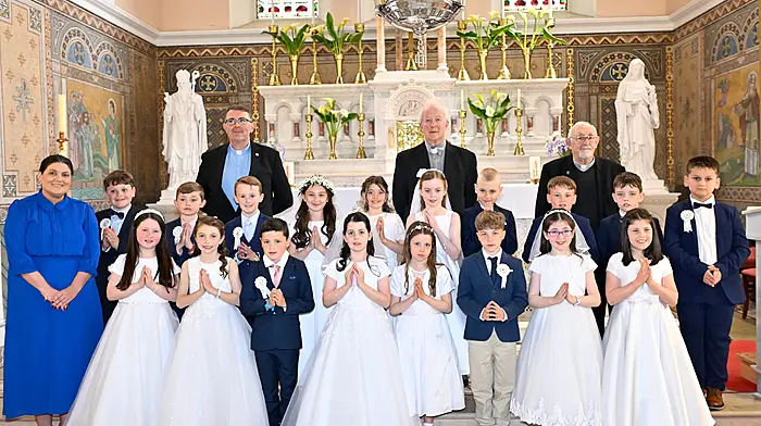 Pupils from second class in Timoleague National School who received their First Holy Communion last Saturday in the Church of the Nativity of the Blessed Virgin Mary, Timoleague.  Also included are (from left): Ms Anne Marie Kelly (deputy principal and class teacher), Fr Chris O'Donovan, Canon John Kingston AP and Monsignor Barry O'Driscoll. (Photo: Martin Walsh)