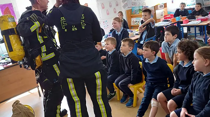 Clonakilty Fire Brigade members giving a talk on fire safety to pupils at Reenascreena National School.