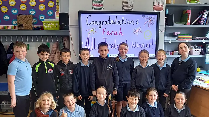 Farah McCarthy, pictured with her Reenascreena National School classmates after her All-Ireland win with the Kilmeen Drama Group.