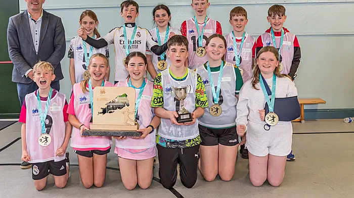 Cahermore National School were the winners of the inaugural Claddagh Ball National School Handball Tournament. Back: Paudie B O’Sullivan, Aoife McMahon, Daithí O’Meara, Kenzie O’Sullivan, Oisin McMahon, Eoin Walsh and Ryan Dudley, Front: Ríoghán Walsh, Croíadh O’Sullivan, Emily Harrington, Jack O’Sullivan, Súin O’Neill and Kelsey O’Sullivan.  (Photo: Anne Marie Cronin)