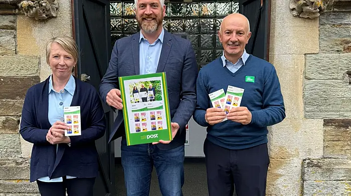 Minister Christopher O’Sullivan with Clonakilty Post Office team members Miriam Cuinnea and Liam Murphy, celebrating the release of An Post’s new postal stamps in collaboration with the National Parks and Wildlife Service promoting protection of nature.