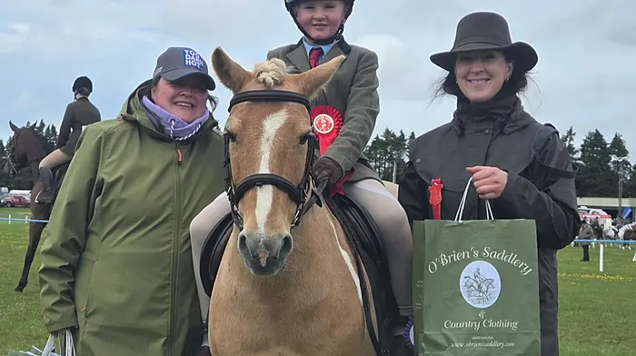 John T O’Driscoll from Kilbrittain with his pony Stocko Loco after winning his class at Bandon Show with Judge Shauna Finnerann from Galway and class sponsor Jayne McCarthy from Meelin Stud.