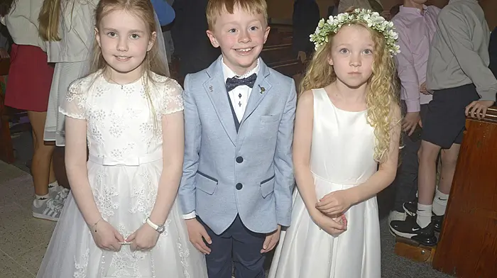 Eve Houlihan, Barry Ahern and Louise Barrett from Ahiohill celebrating their First Holy Communion at St Mary’s Church in Enniskeane.   (Photo: Denis Boyle)