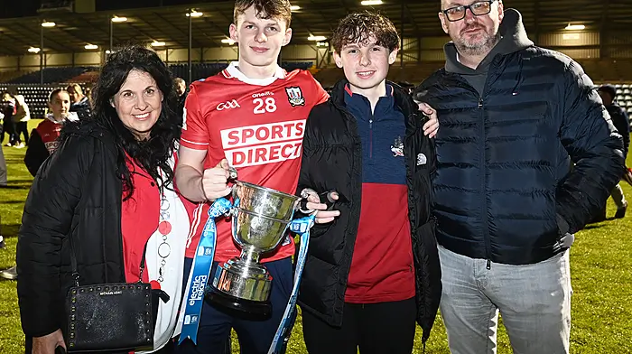 Blarney's Colm O'Riordan, a member of the Cork minor football team that defeated Kerry in the Electric Ireland Munster GAA Football Minor Championship in Páirc Uí Rinn on Monday night, with (from left) his mum Colette Kidney, brother Odhran O'Riordan and dad Liam O’Riordan.   (Photo: Martin Walsh)