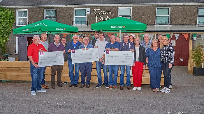 The Ballygurteen Harvest Festival committee presenting cheques to its three chosen charities from its threshing, tractor, car and truck run which was held in early October in memory of Jerry Keohane. From left: Gerard O’Connor (MS Ireland Cork Branch committee member), Don Looney (chairman, Cork MS Branch), Bobby Patterson, Ronan Hurley, John O’Sullivan (driver, Cancer Connect), John Miller, Linus Sloan (driver, Cancer Connect), Mark Tobin, Cathal McCarthy, Liam Patterson (accepting the cheque on behalf of the Irish Liver Foundation), Joe O’Toole, Val Keohane, Sandra Patterson, Hannah Keohane, Finbarr Fitzpatrick, Sinead Daly, Pat Daly and Kay Keohane. Each charity received €2,000 and thanks was expressed to everyone who supported the event.   (Photo: Noel M Photogrpahy)
