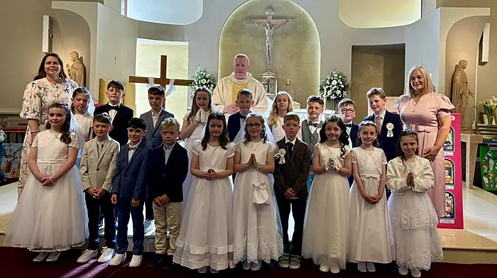 Rath National School and Abbeystrewry National School’s First Holy Communion candidates with teacher Ms Griffiths, Fr Evin O’Brien and principal Maura Collins.