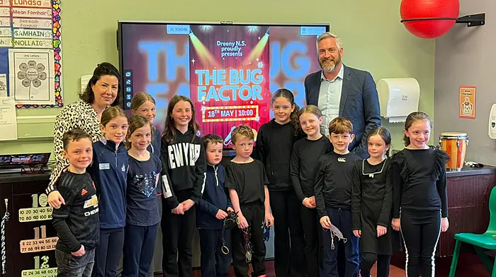Minister Christopher O’Sullivan with Jenny Byrne (principal) and students of Dreeny National School who put on a production of ‘The Bug Factor’ for the minister, as part of Biodiversity Week bringing awareness to the plight of insect life in Ireland.