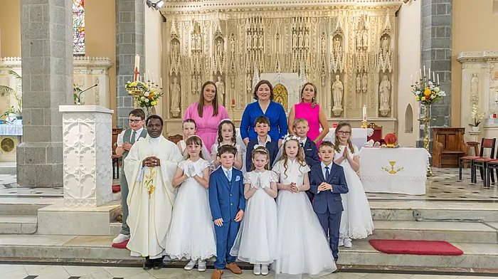 Pupils from Castletownbere who made their First Holy Communion. Back: Katie Blake, Deirdre Lehane and Caoimhe Healy. Middle: Jack O’Shea, Jessica O’Shea, Olive O’Sullivan, Aaron O’Sullivan, Nathan Van Den Berg and Ruth O’Shea. Front: Fr Amos, Lilly Power Redding, Dylan Shanahan, Eadaoin Cronin, Fiadh O’Sullivan and Mark Twomey.  (Photo: Anne Marie Cronin)