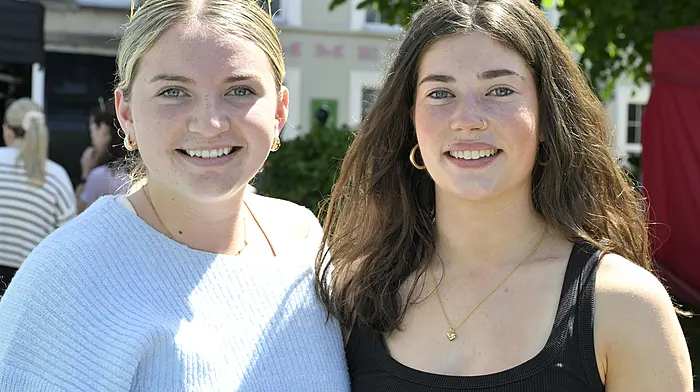 Meabh O'Sullivan (left) from Timoleague and Amy McCarthy, Clonakilty met up to chat about their respective upcoming summer holiday trips.  (Photo: Martin Walsh)