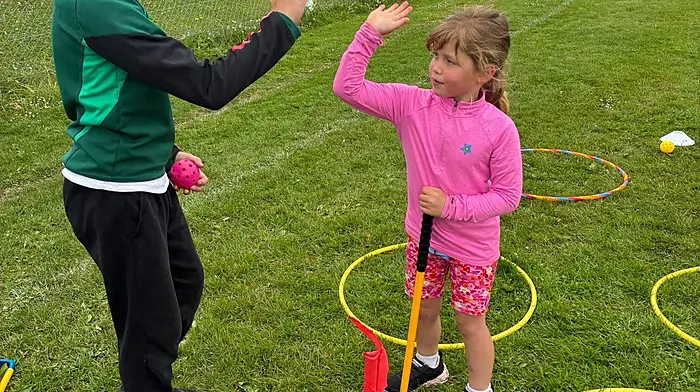 Great team work from Luka Perry Clark (6th class) and Felicity Baker (junior infants) during Rath National School’s sports day at the mini golf station Luka had created.
