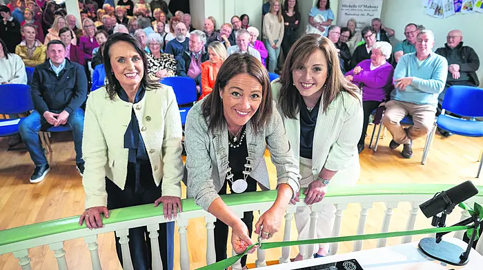 Cllr Deirdre Kelly and Cllr Caroline Cronin, chair of the West Cork Municipal District with Michelle O Mahony, of OM History Consultant and Communications cutting the ribbon with a 1948 vintage scissors to officially launch ‘Stories on the Street’, a community heritage project celebrating the people, places, and memories of Dunmanway.   (Photo: John Allen)