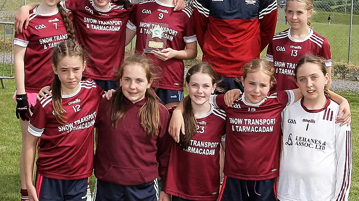 Ballinacarriga NS, runners up in Roinn 6, with Cork footballer Ruairí Deane. (Photo: Paddy Feen)