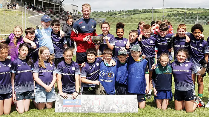 Leap NS, winners of Roinn 9 Mixed, with Cork senior footballer Ruairí Deane. (Photo: Paddy Feen)