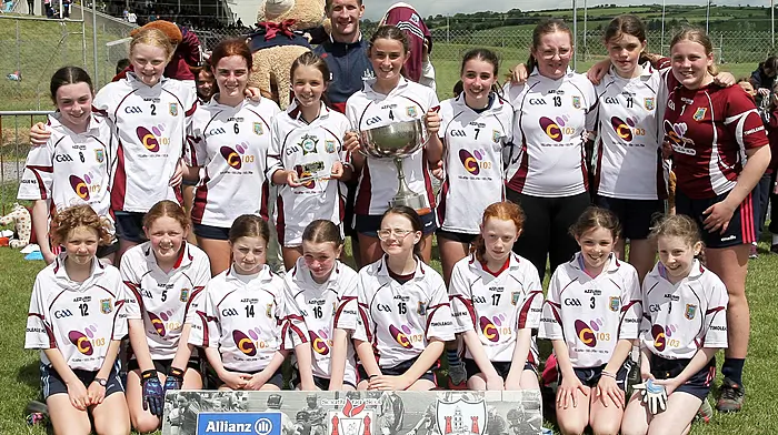 Timoleague NS, winners of Roinn 3 Girls, with Cork footballer Ruairí Deane. (Photo: Paddy Feen)