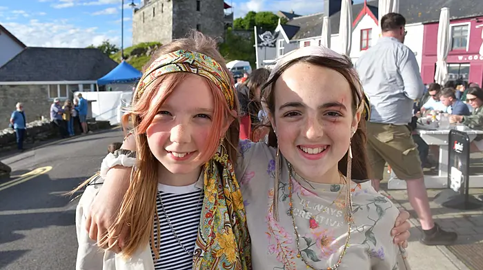 Joni Perry Clarke and Keziah Low enjoying the opening parade of the Baltimore Pirate Festival last weekend. Photo; Anne Minihane.