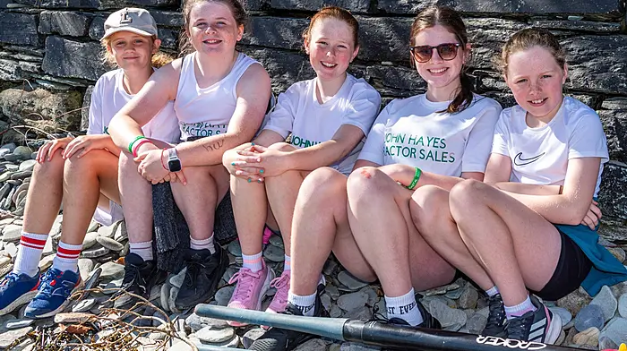 Union Hall, West Cork, Ireland. 21st Jun, 2026. On a hot and sunny day in West Cork, Myross Rowing Club hosted the annual Union Hall Regatta. Teams from across West Cork took part in the event with hundreds of competitors and spectators descending on the fishing village. Taking a break before their races were Laoise Morley; Eve Harrington; Brooke Brazier Scannell; Amy Harrington and Lilian O'Mahony from Galley Flash Rowing Club. Picture: Andy Gibson.