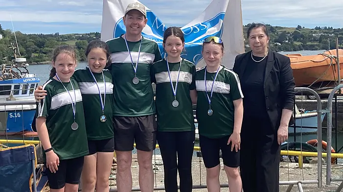 The Dunmanway Rowing Club U12 women’s crew took home silver at the second round of the South West Championship at the recent Union Hall Regatta. Grace Jagoe, Lauren Hegarty, Tully Coll, Aoibhínn Coll and Ellie O’Regan with Ann Downey, general manager Celtic Ross Hotel.
