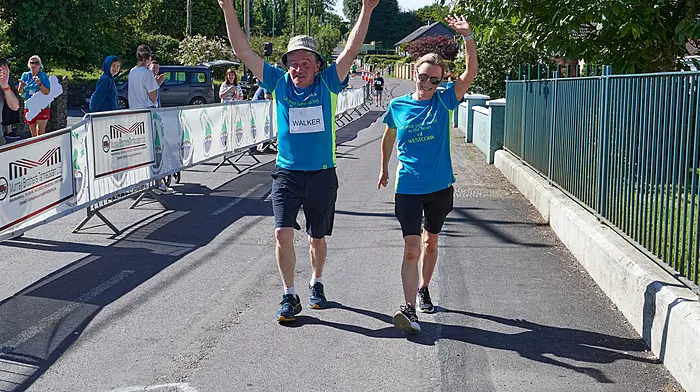 Mikey O’Regan and Paula O’Leary crossing the finish line at the Dunmanway 10k.
