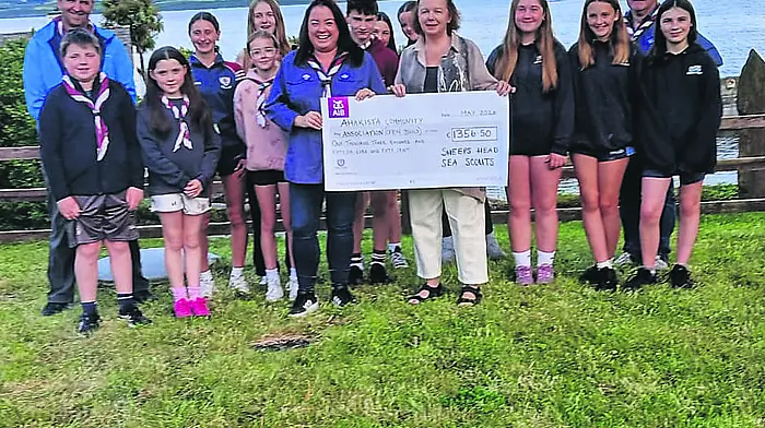 The Sheep's Head Sea Scouts recently held two cake sales in aid of the Ahakista Community Centre Building Fund. They raised a brilliant total of €1,356.50. Pictured among the Scouts and their leaders was Elmarie Lynch presenting the cheque to Josephine Mulhall (right), chairperson of the Ahakista Community Association.