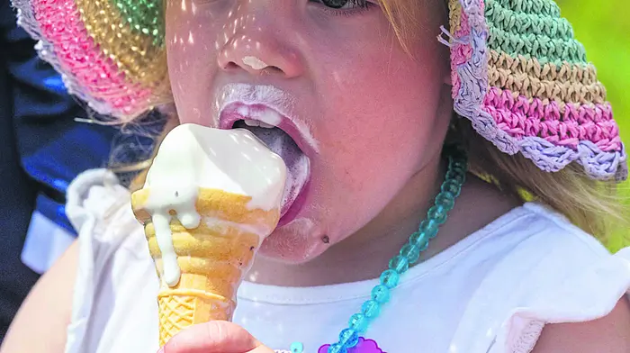 Dunmanway, West Cork, Ireland. 5th Jul, 2026. Dunmanway Agricultural Show took place today in sunny weather with thousands of people attending. Enjoying an ice cream at the show was Elsie Fahy from Skibbereen. Picture: Andy Gibson.