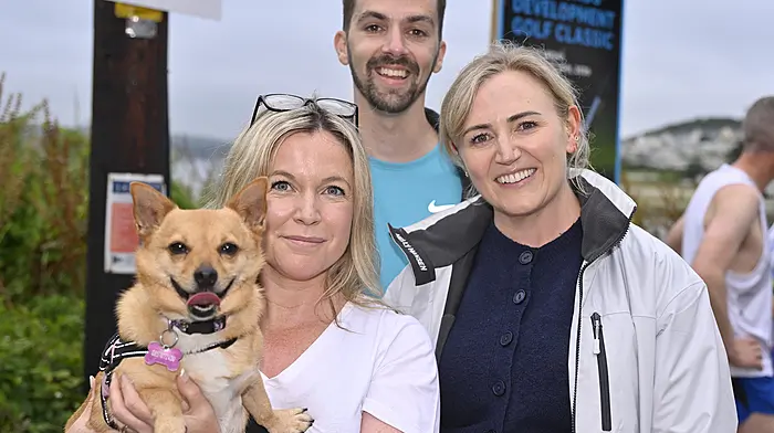 Watching the Courtmacsherry 10km road race last weekend were (left to right): Joanna McDonnell and her dog Peggy Sue, Darren Foord and Ailbhe McDonnell from Clonakilty. Photo: Martin Walsh.