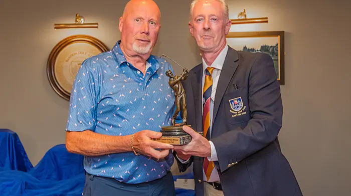 “Bandon Golf Winner,” (L to R) John E O’Donovan accepting the Captain’s Prize from Bandon Golf Club Captain, James A Barrett after the recent competition.