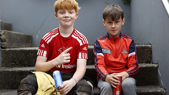 Conall Lanin and TJ Barry enjoying a well-earned break after a hard day's work on the farm in Schull. Photo by Carlos Benlayo