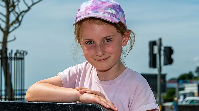 Bantry, West Cork, Ireland. 10th Jul, 2026. Bantry basked in 26°C temperatures today as Met Éireann has classed the hot weather as a heatwave. Enjoying the hot weather was Muireann Foley from Bantry. Picture: Andy Gibson
