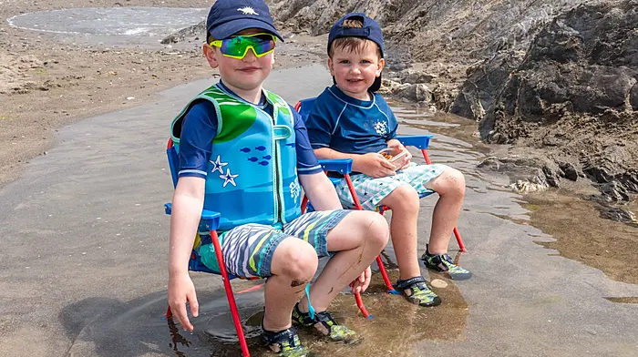 Owenahincha, West Cork, Ireland. 9th Jul, 2026. On a warm and sunny day in West Cork, with temperatures reaching 21°C, people enjoyed a day at the beach. Chilling out in the water were Fionn & Oisín McCarthy from Glengarriff. Picture: Andy Gibson.