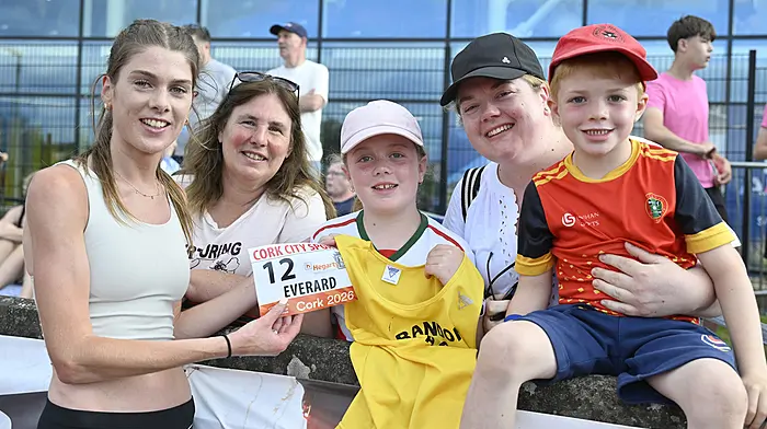 Bandon athlete Fiona Everard, who competed in the 3000 metres Women's Race at the 72nd Cork City Sports in the MTU Athletics Stadium last Wednesday finishing sixth, gives her race number to Bandon's Mary Kate Cassidy, also included are (left to right) Denise Wilmot, Christina Desmond and Cian Cassidy, all from Bandon. Photo: Martin Walsh.