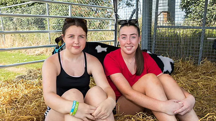 SPEC: FARMING:   Barryroe, Cork, Ireland. 11th July 2026. Josephine Kelleher and Kayla Mulcahy from Bandon sitting in the shade at the annual agricultural show that was held on a sunny summers day at Barryroe, Co. Cork. - Picture: David Creedon