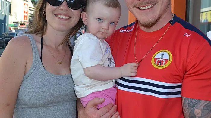 Naomi O'Donovan, Zara and Thomas Hegarty out supporting the runners and walkers in the Run Skibb 5k last weekend. Photo; Anne Minihane.