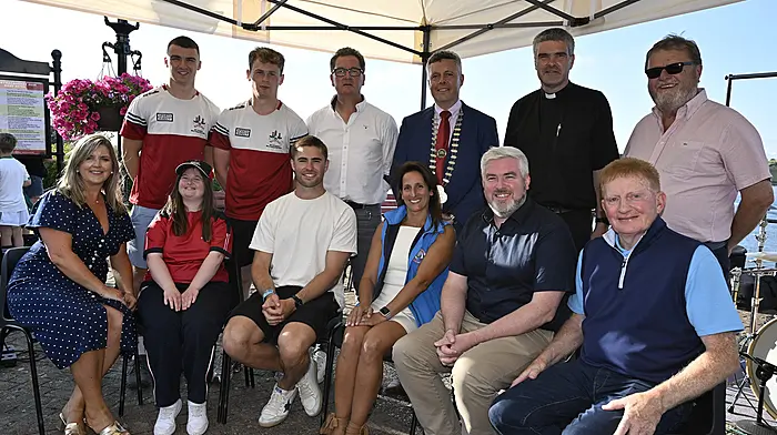 At the official launch of the Courtmacsherry Harbour Festival last Saturday are (front, from left): Cllr Ann Bambury, Maria Couch (Special Olympics athlete), Jack Crowley  (Irish Rugby International fly-half), Anat O'Donovan, Stephen Finn and Vincent O'Donovan.  Standing: Riley O'Donovan and Conrad Murphy (members of the winning Cork All-Ireland minor football team), Mike Hanly, Cllr John Michael Foley (deputising for Cllr Bernard Moynihan), Fr Anthony O'Mahony, and Cllr John Collins.   (Photo: Martin Walsh)