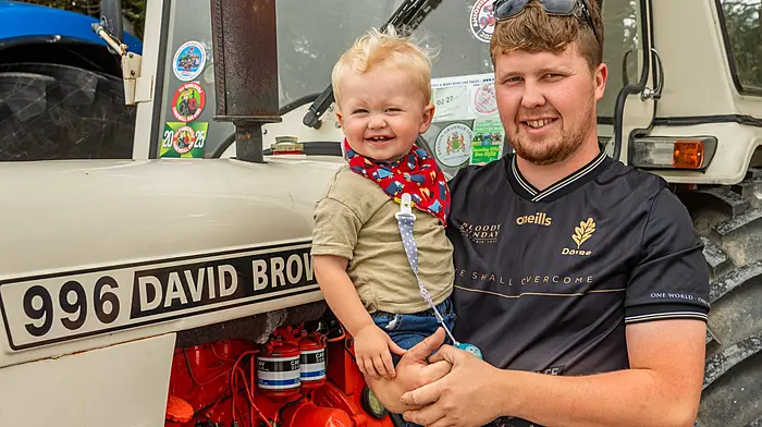 Callan O'Leary (1) from Kilbrittain and his dad Richard at Pike Festival’s charity tractor, truck and car run which was held last Sunday in aid of West Cork Rapid Response and other local charities. (Photo: Andy Gibson)