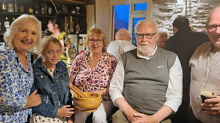 The caption for the attached photo is:At Jimmys Bar, Allihies recently a surprise presentation was made to Mary Jo Murphy for her trojan work correcting answers at approximately 200 Pub Quiz fundraisers over the last 30 years. The presentation included a salad bowl made by the Allihies Men's Group. (Left to right) Anne McNally, Mary Jo's granddaughter Aoife, Mary Jo, Quizmaster Supreme Frank Creedon and Liam Murphy.