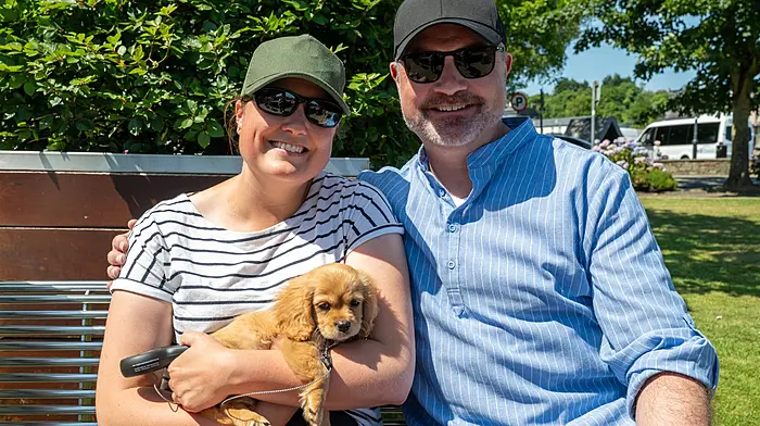 Chloe Hogan and Geared Hogan with puppy ‘Bella’ from Carrigaline enjoying the sun during the recent Kinsale Arts Weekend.  (Photo: John Allen)