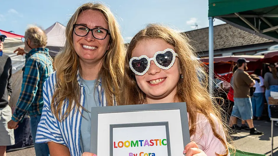 Young entrepreneur Cora Hennessy from Leap was selling her home made loom bands at the market with help from her mum Amy. Picture: Andy Gibson.