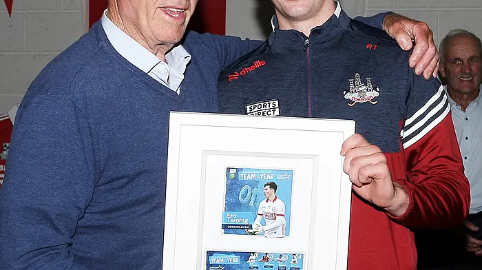 DJ Daly, president of Kilmeen/Kilbree GAA Club, makes a presentation to Rory Twohig in recognition of his achievements with the All-Ireland winning Cork minor football team. (Photo: Paddy Feen)